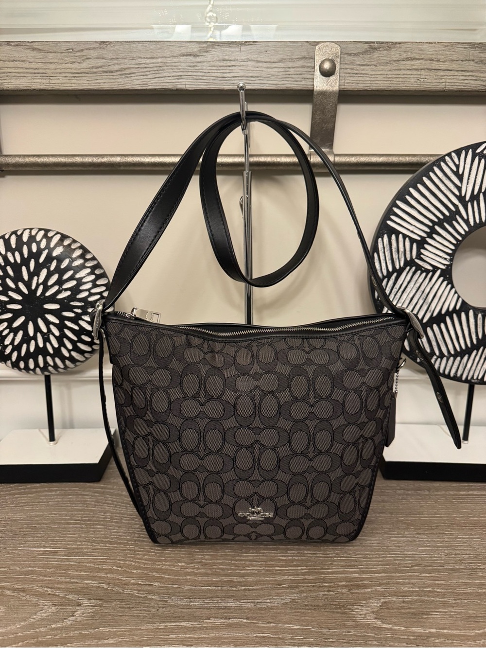 Coach Signature Dufflette crossbody bag.